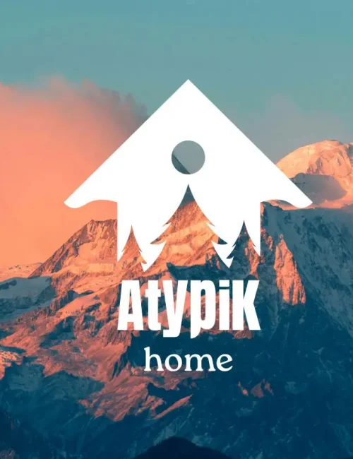 montagne au soleil couchant avec logo atypik home en son centre